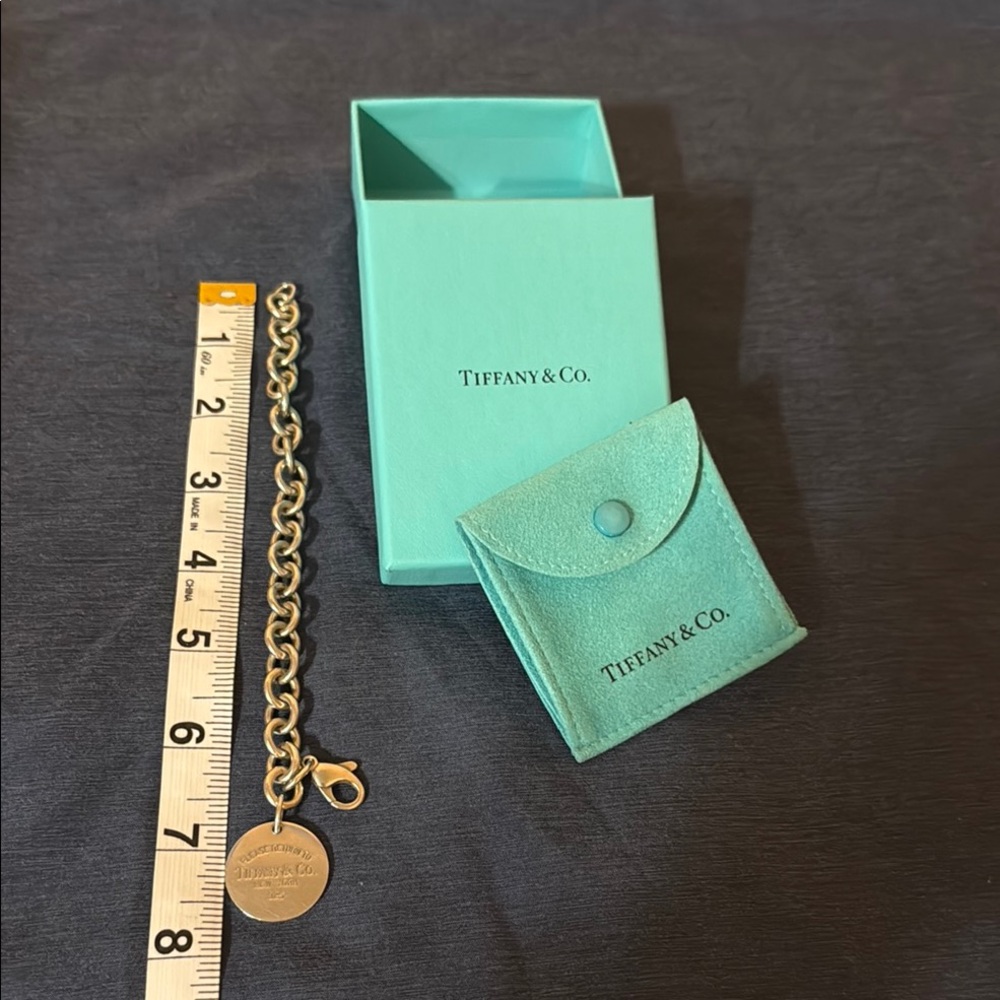 Tiffany & Co. Authentic Vintage charm round tag bracelet in 925 Sterling Silver
